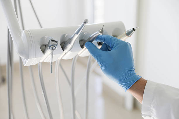 Professional Tooth Extraction technician working in Centreville, IL